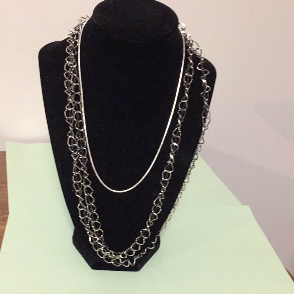 Two silver chains necklaces jewelry, as shown